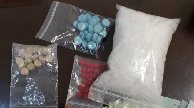 Several bags of pills

Description automatically generated