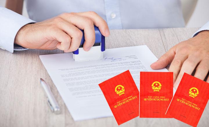 A person stamping a document
Description automatically generated