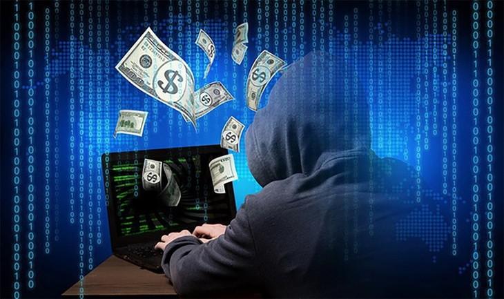 A person in a hoodie using a computer

Description automatically generated