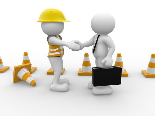 A person in hardhat shaking hands with another person in hardhat

Description automatically generated