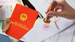 A hand holding a stamp over a document
AI-generated content may be incorrect.