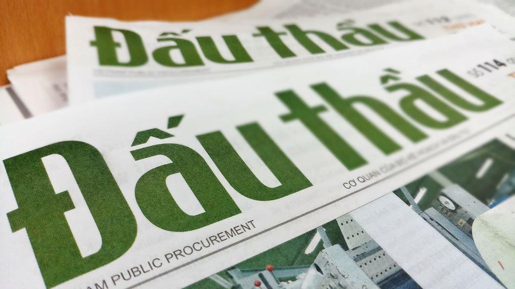 A close-up of a newspaper

Description automatically generated