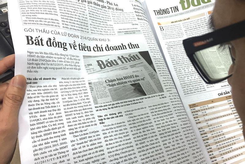A close-up of a newspaper

Description automatically generated