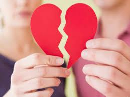 A couple holding a broken heart

Description automatically generated